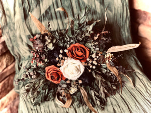 Navy terracotta fall wedding bouquet with babies breath and eucalyptus