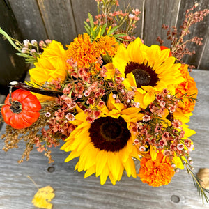 Mountain customized vase with a fall/autumn assorted mix floral arrangement
