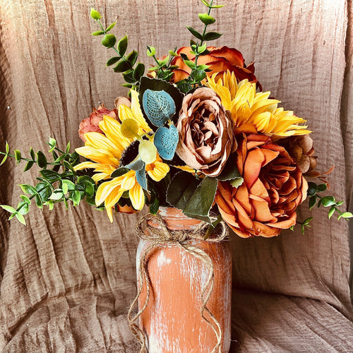 Terracotta painted mason jars - Terracotta themed sunflower wedding table decor -